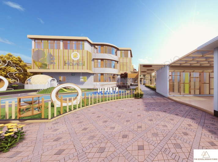 Front elevation of The Hugs and Cuddles, Ahmedabad in Ahmedabad by The School Designs Studio, showing entrance pathway, outdoor play area, and child-centric school building design- Featured iamge