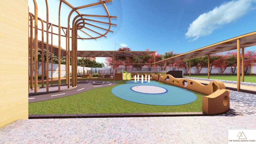 Premium outdoor play area at The Hugs and Cuddles Haven Ahmedabad designed by The School Designs Studio featuring water play zone, amphitheatre, trampoline and nature-based preschool architecture