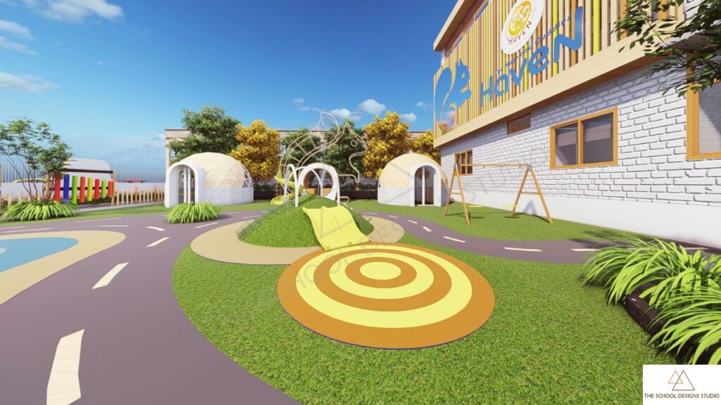 Outdoor play area at The Hugs and Cuddles Haven Ahmedabad designed by The School Designs Studio, featuring interactive play elements, sensory landscape, and safe child-centric preschool environment