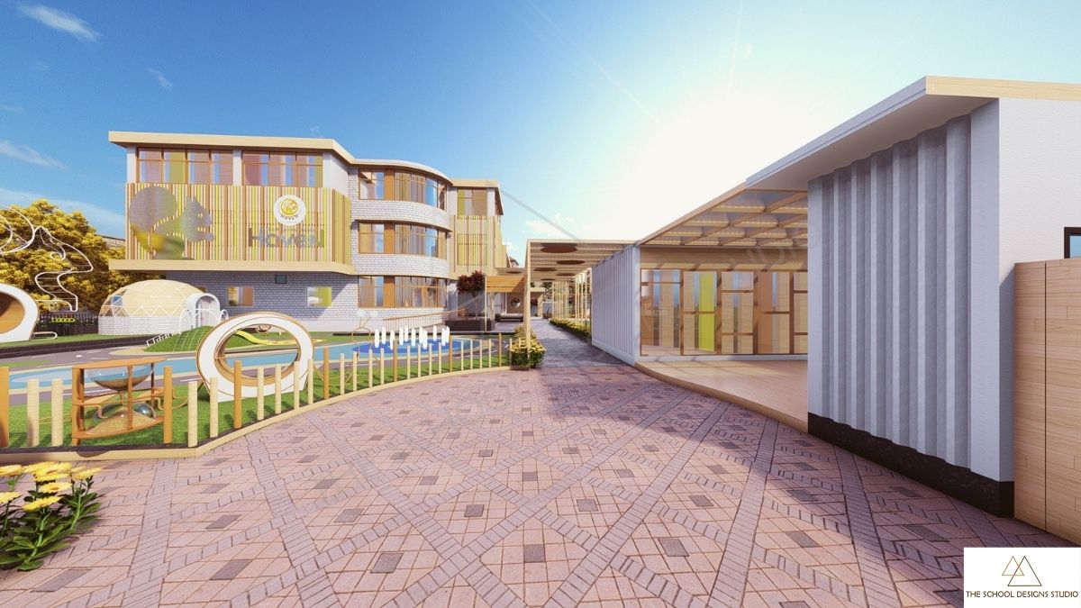 Front elevation of premium preschool in Ahmedabad by The School Designs Studio, showing entrance pathway, outdoor play area, and child-centric school building design